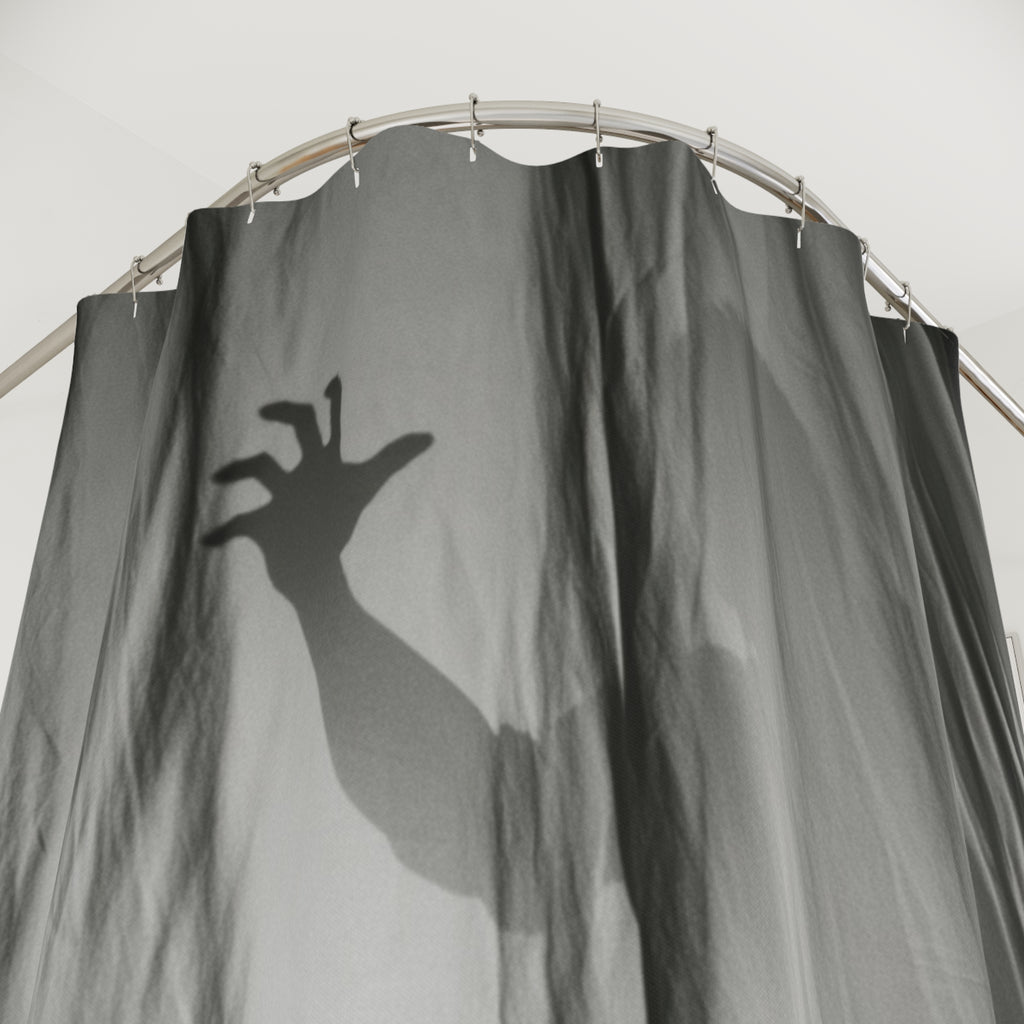 Dark gray shower curtain close-up of spooky hand silhouette over rippled fabric