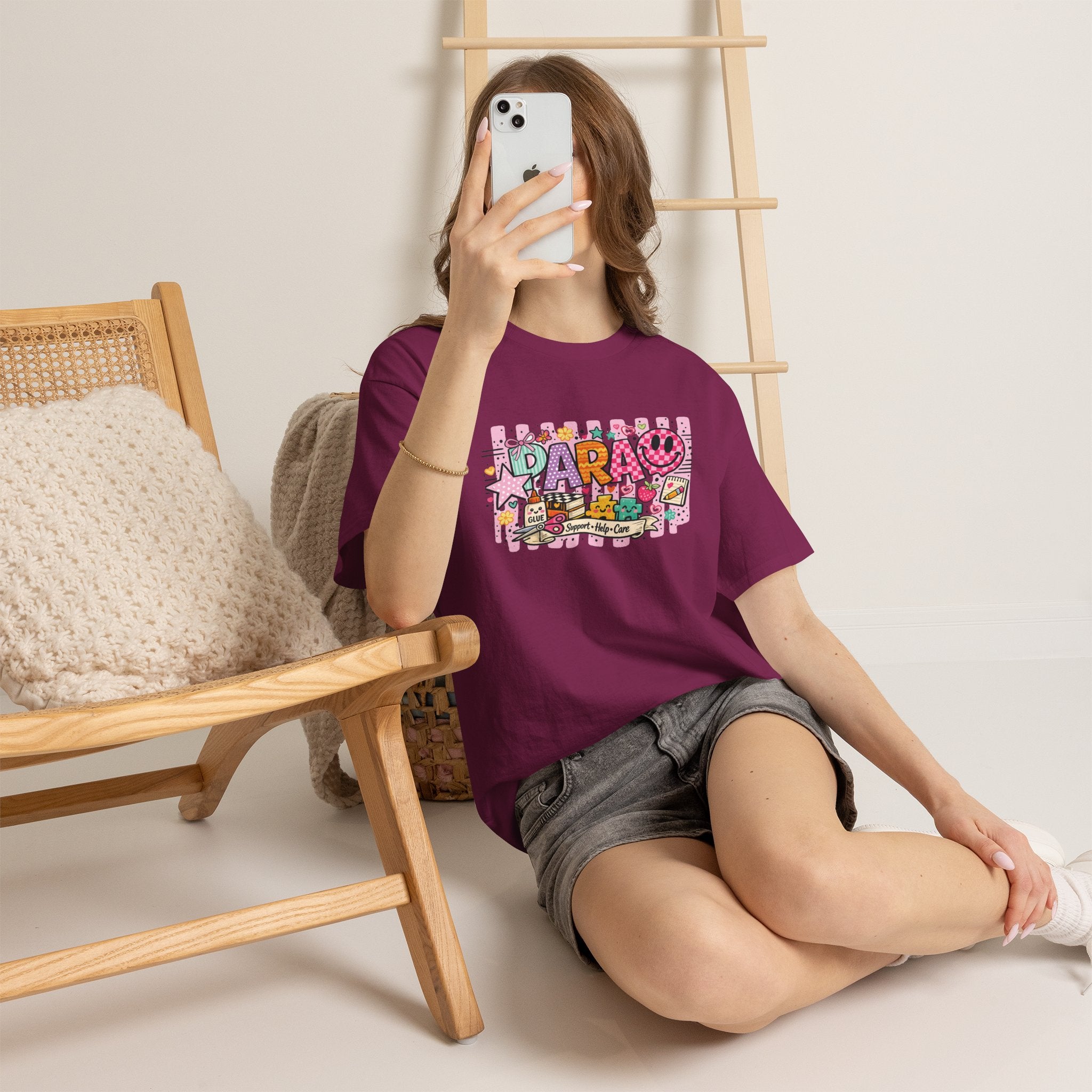 Daro graphic cartoon T-shirt in burgundy with colorful IDARO collage print, model wears